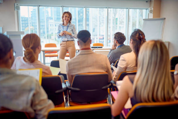 Senior business woman holding presentation lecture in congress